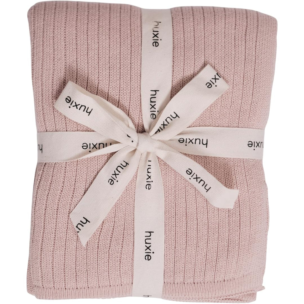 Huxie knitted baby blanket ribbed blush close-up for sensitive skin comfort.