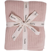 Huxie knitted baby blanket ribbed blush close-up for sensitive skin comfort.