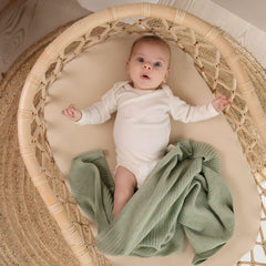Huxie knitted baby blanket Roman Green closeup knit shows soft organic cotton texture.