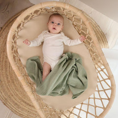 Huxie knitted baby blanket Roman Green colorway provides breathable comfort for year-round use.