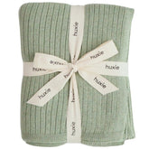 Huxie knitted baby blanket Roman Green folded for cozy snuggles.