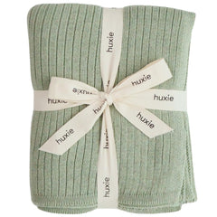 Huxie knitted baby blanket Roman Green folded for cozy snuggles.