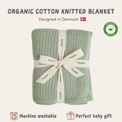 Huxie knitted baby blanket Roman Green in stroller for on the go warmth.