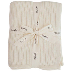 Huxie Knitted Baby Blanket soft white closeup shows plush organic cotton texture for sensitive skin