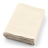 Huxie knitted organic baby blanket close-up shows ultra-soft cotton for sensitive skin.