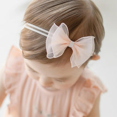 ICKEYOU toddlers lace bow headband; soft cotton and elastic for snug, non-slip wear.