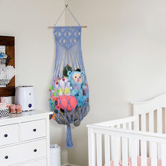 iHansee boho-macrame-toy-hammock-dark-blue adds stylish wall decor while keeping toys organized