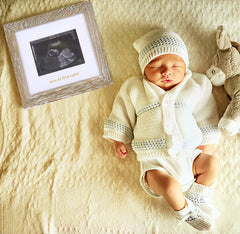 IHEIPYE Rustic White frame highlights warm tones perfect for a newborn nursery or bedside table.