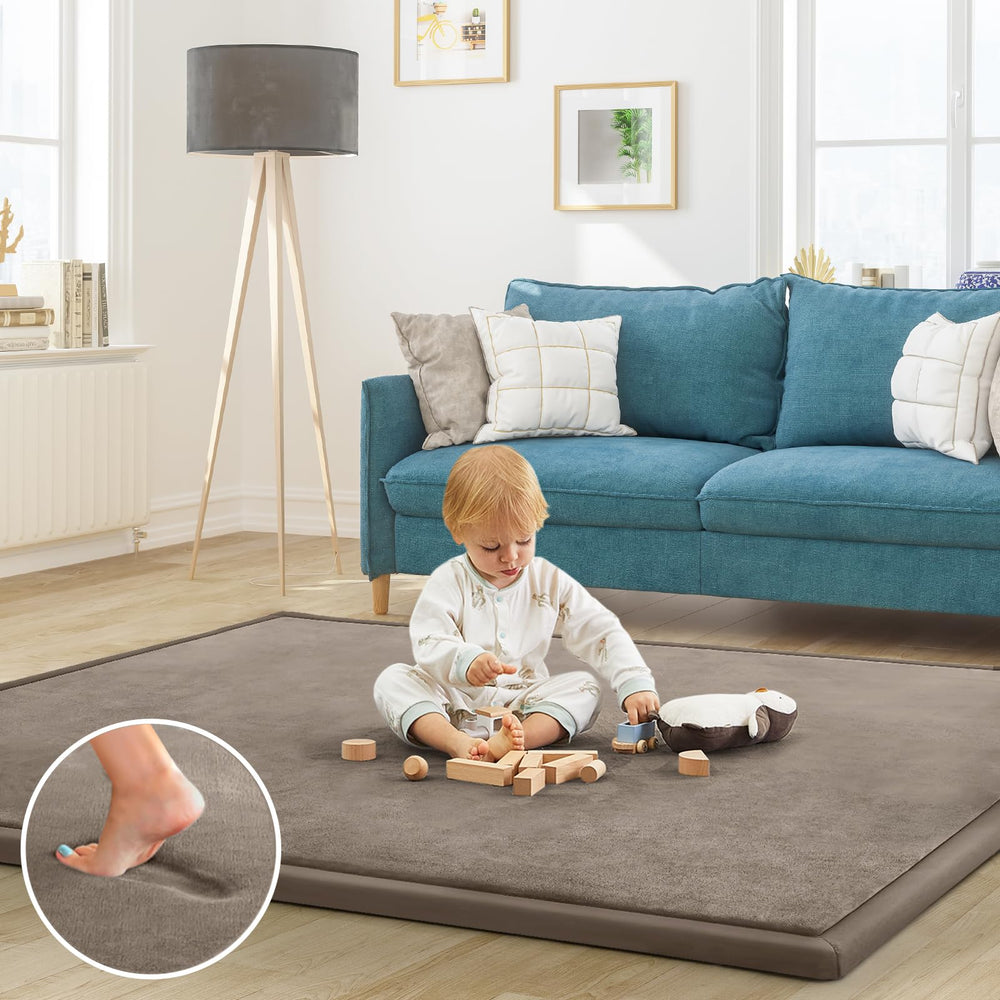 ILPEOD baby play mat with coral velvet surface provides a soft, safe play area.