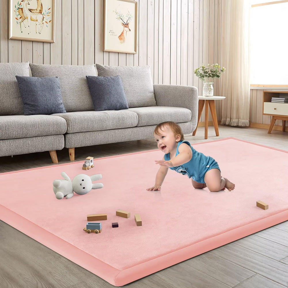 ILPEOD baby play mat pink on floor with soft cushioned surface for comfortable play