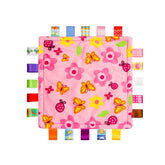 Inchant Colorful Ribbons baby taggy blanket close-up showing soft minky fabric for gentle comfort.