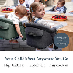 Inglesina Fast Table Chair attached to a thick table for stable family meals.