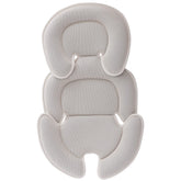 Innokids beige head and body support pillow for car seats improves newborn comfort.