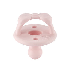 Itzy Ritzy primrose pacifier coordinates outfits while soothing during feeds.