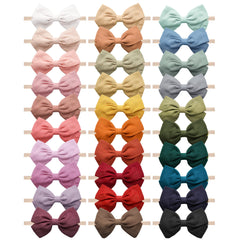 Jesries 30-pcs baby headbands closeup with linen bows and gentle fabric for newborns