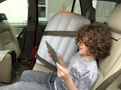 Jet Creations inflatable backseat divider installed for a calmer ride.