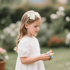 JIAHANG small bow clip white close-up shows durable grip and pearl accents.