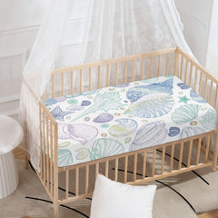 Starfish pattern on a JIANADAER crib sheet adds ocean-inspired nursery style.