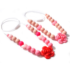 Jissoo silicone rose necklace red for nursing bonding and visual focus