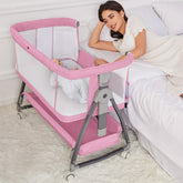 Jixrolyn pink bassinet standalone crib offers a compact newborn sleep space.