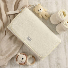 JJOO travel changing pad with mesh pockets for quick access to wipes and diapers.
