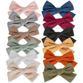 JoCoDesigns baby girl hair clips display 12-color assortment for versatile styling and coordinated outfits.