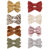 JoCoDesigns leopard cotton hair bow clip adds playful style and secure hold