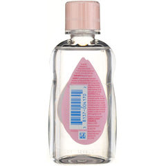 Johnson & Johnson Baby Oil bottle pour shows easy, mess-free application.