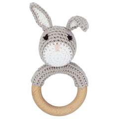 Joliecraft natural wooden baby rattle showing handcrafted stitches and safe teether ring