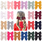 Jollybows 40pcs woolen baby bows on clips show soft comfort for toddlers.