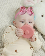 Jollybows pink bow headband close-up shows girlish charm and secure fit.