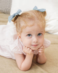 Jollybows girl hairstyle shot showing clip used to pull back ponytail or plait neatly.