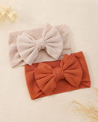 jollybows knit fabric bow detail shows craftsmanship and secure attachment