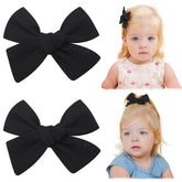 Jollybows neutral linen bows clip closeup demonstrates soft fabric ideal for gentle daily wear.