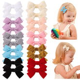 Jollybows velvet baby bows with a close-up on the secure clip for secure toddler hair