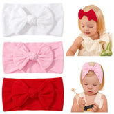 Jollybows white bow headband gentle on skin for everyday newborn outfits.