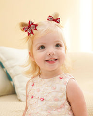 Jollybows white Christmas bow on a clip for a classic holiday look