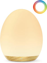 JolyWell Night Light egg on bedside providing gentle guidance for midnight feeding.