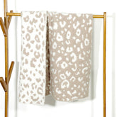JOOJA soft baby cozy swaddling blanket in beige cheetah pattern offers gentle warmth for newborns.