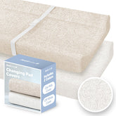 Jool Baby changing pad covers in off-white demonstrate soft fabric for newborn comfort.