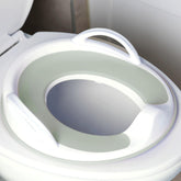 Jool Baby potty seat with handles in sage offers added stability for kids.