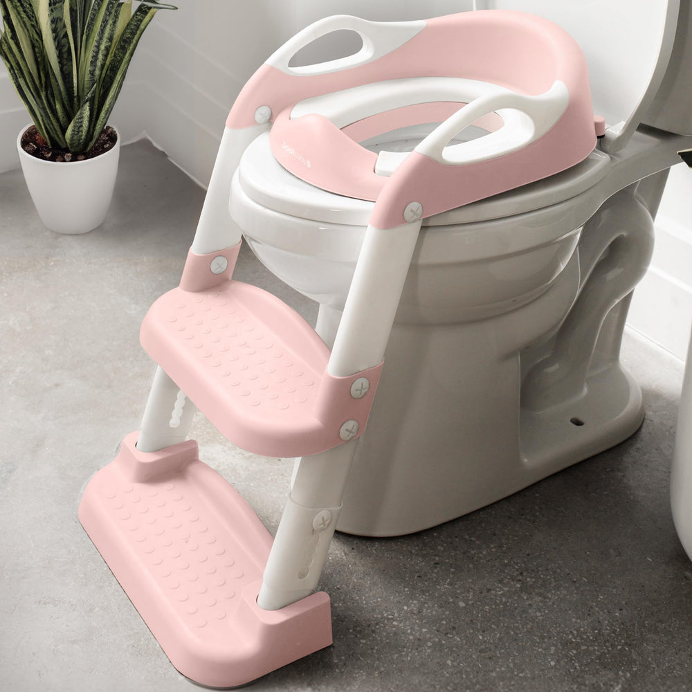 Jool Baby potty training seat with pink two-step ladder supports independent toilet use.
