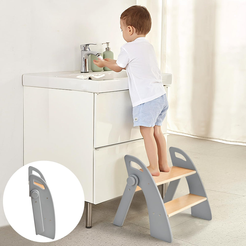 Joothlin wooden 2-step stool at bathroom sink, foldable for compact storage.