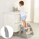 Joothlin wooden 2-step stool at bathroom sink, foldable for compact storage.
