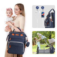 Joyce diaper bag backpack changing table in use for on-the-go diaper changes.