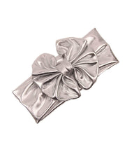 JustMyDress baby headband big bow close-up showcases festive sparkle.
