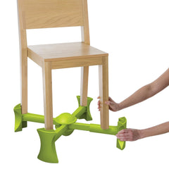 KABOOST booster seat green attached to chair for quick, secure seating