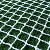 KACQIHTU rope net on a railing provides a kid friendly safety barrier for stairs.