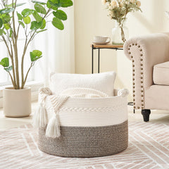 KAKAMAY blanket basket in living room with blankets and pillows for tidy decor and access.