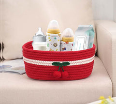 Kamuavni red basket on shelf offers versatile fruit or plant container.